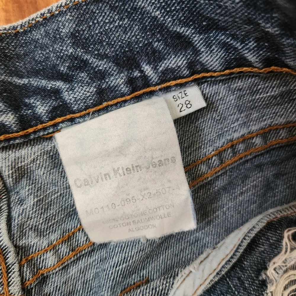 Vintage Calvin Klein Jeans Ripped Blue Jean Shorts, Size 28